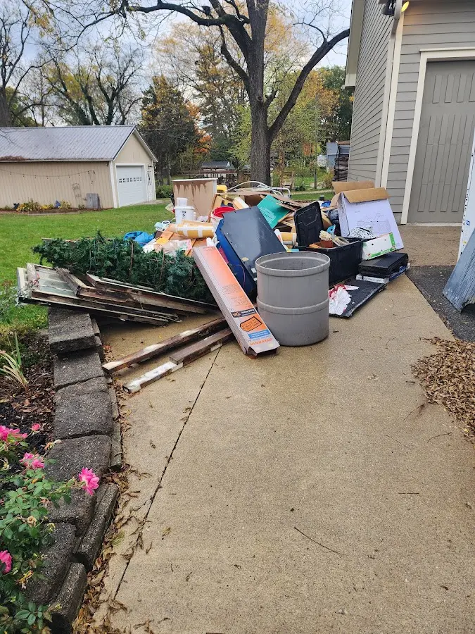 Dumpster being loaded with debris for Residential Dumpster Rental in Windcrest